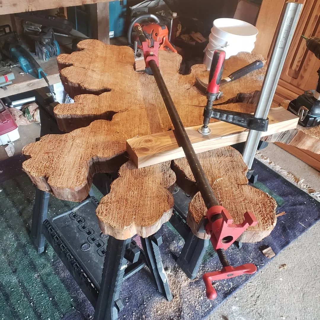 Live-edge coffee table with welded steel legs and clear finish