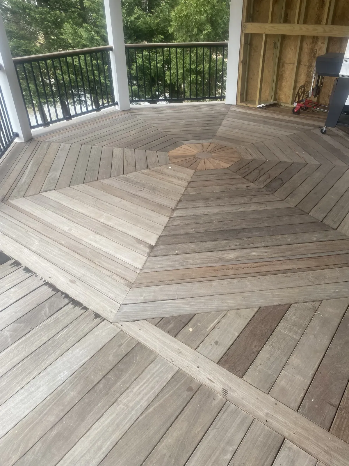 Close-up of herringbone pattern cedar deck boards showing craftsmanship
