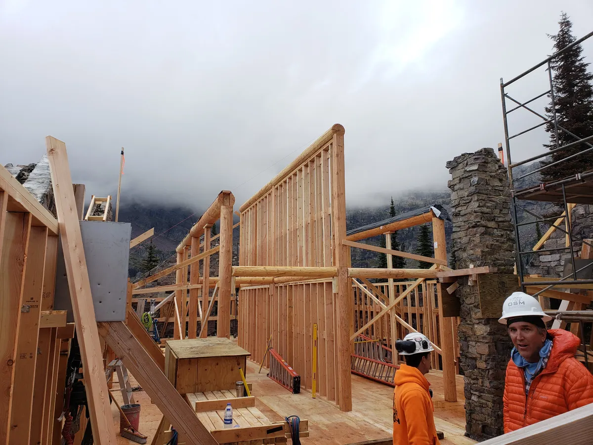 Heavy timber beam installation during frame raising